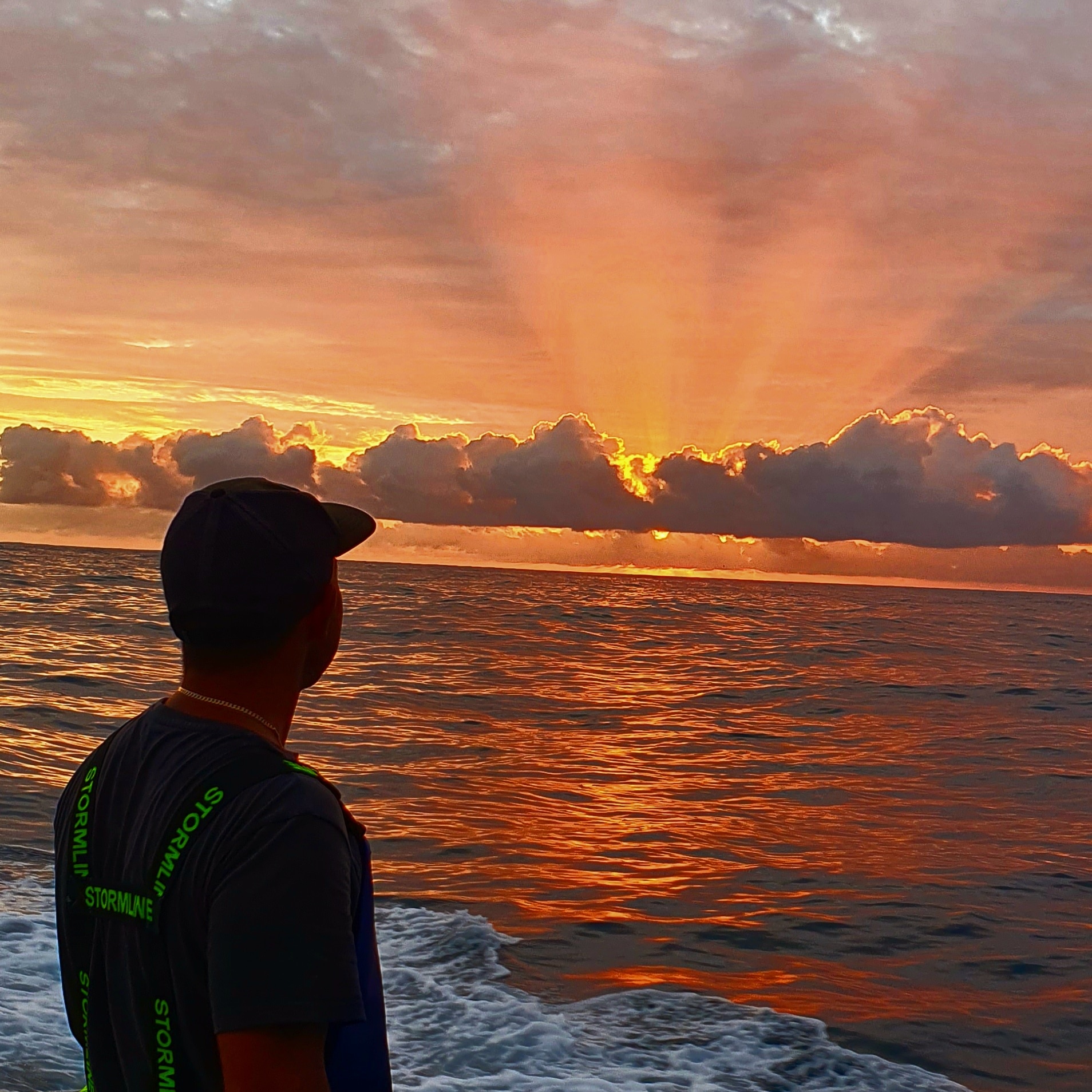 Fisherman overlooking the horizon in the ocean